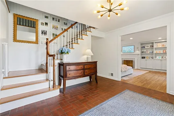 a view of a livingroom with furniture staircase and a living room
