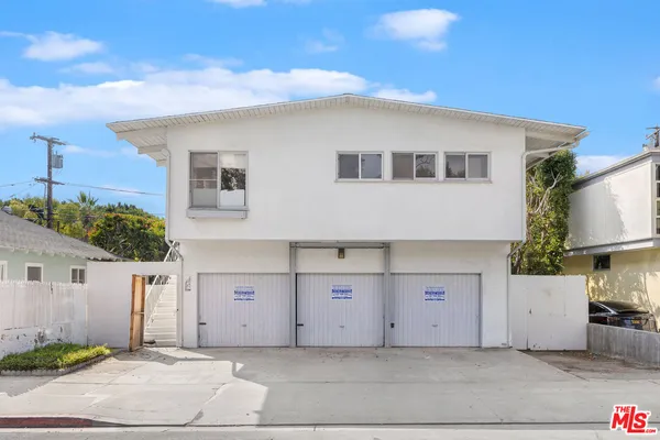 a front view of a house with a garage