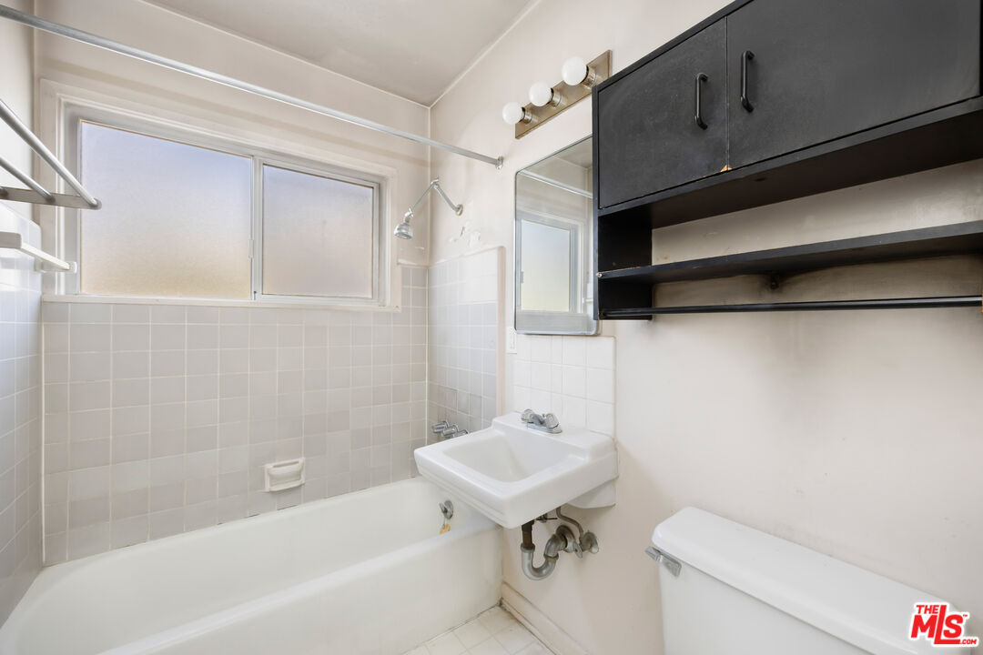 2922 2nd Street Santa Monica, CA 90405 - Photo 13 of 16 a bathroom with a sink a toilet and bathtub