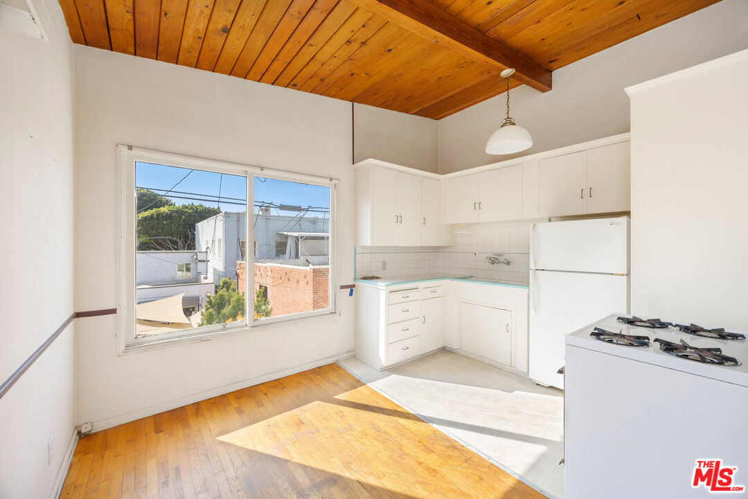 2922 2nd Street Santa Monica, CA 90405 - Photo 7 of 16 a large white kitchen with a large window