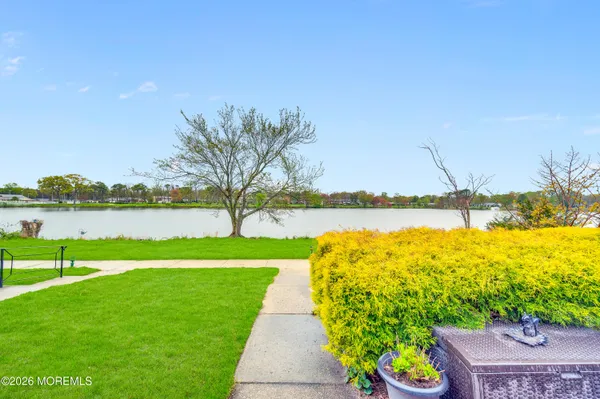 a view of a lake with a big yard