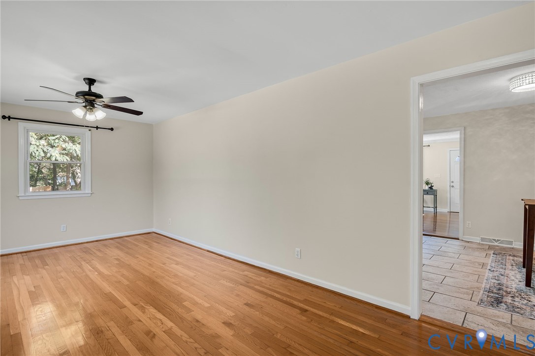 19011 Matoaca Road Petersburg, VA 23803 - Photo 2 of 44 a view of an empty room with wooden floor
