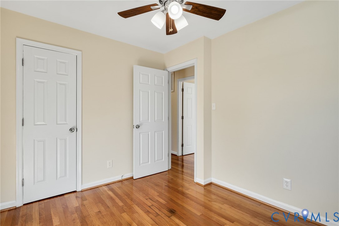 19011 Matoaca Road Petersburg, VA 23803 - Photo 21 of 44 an empty room with wooden floor closet and windows