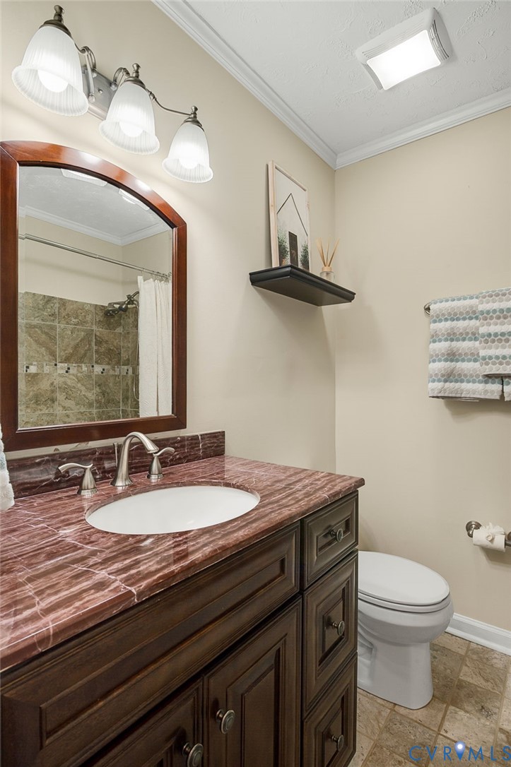 19011 Matoaca Road Petersburg, VA 23803 - Photo 24 of 44 Full bath with crown molding, vanity, and curtaine