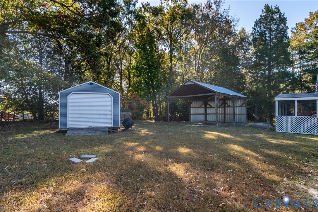 19011 Matoaca Road Petersburg, VA 23803 - Photo 31 of 44 a view of a house with a yard and large tree