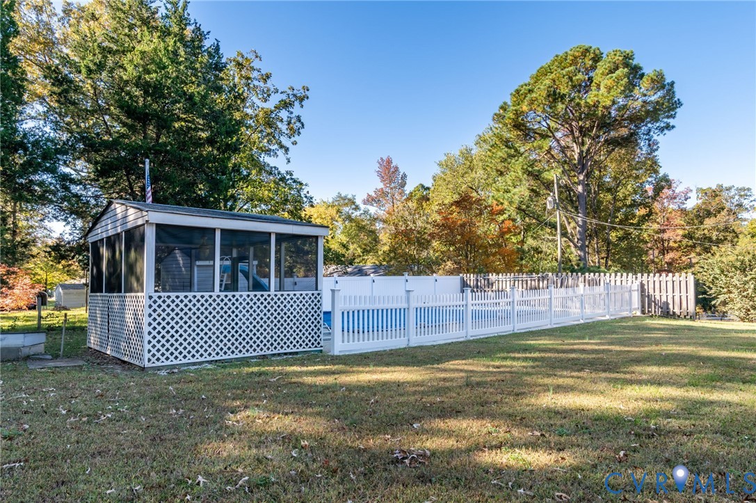 19011 Matoaca Road Petersburg, VA 23803 - Photo 32 of 44 a view of a house with a yard and a large tree