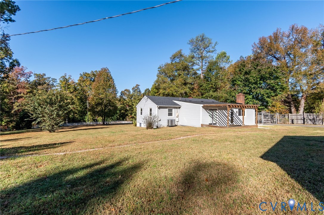 19011 Matoaca Road Petersburg, VA 23803 - Photo 34 of 44 a front view of a house with a yard and garage
