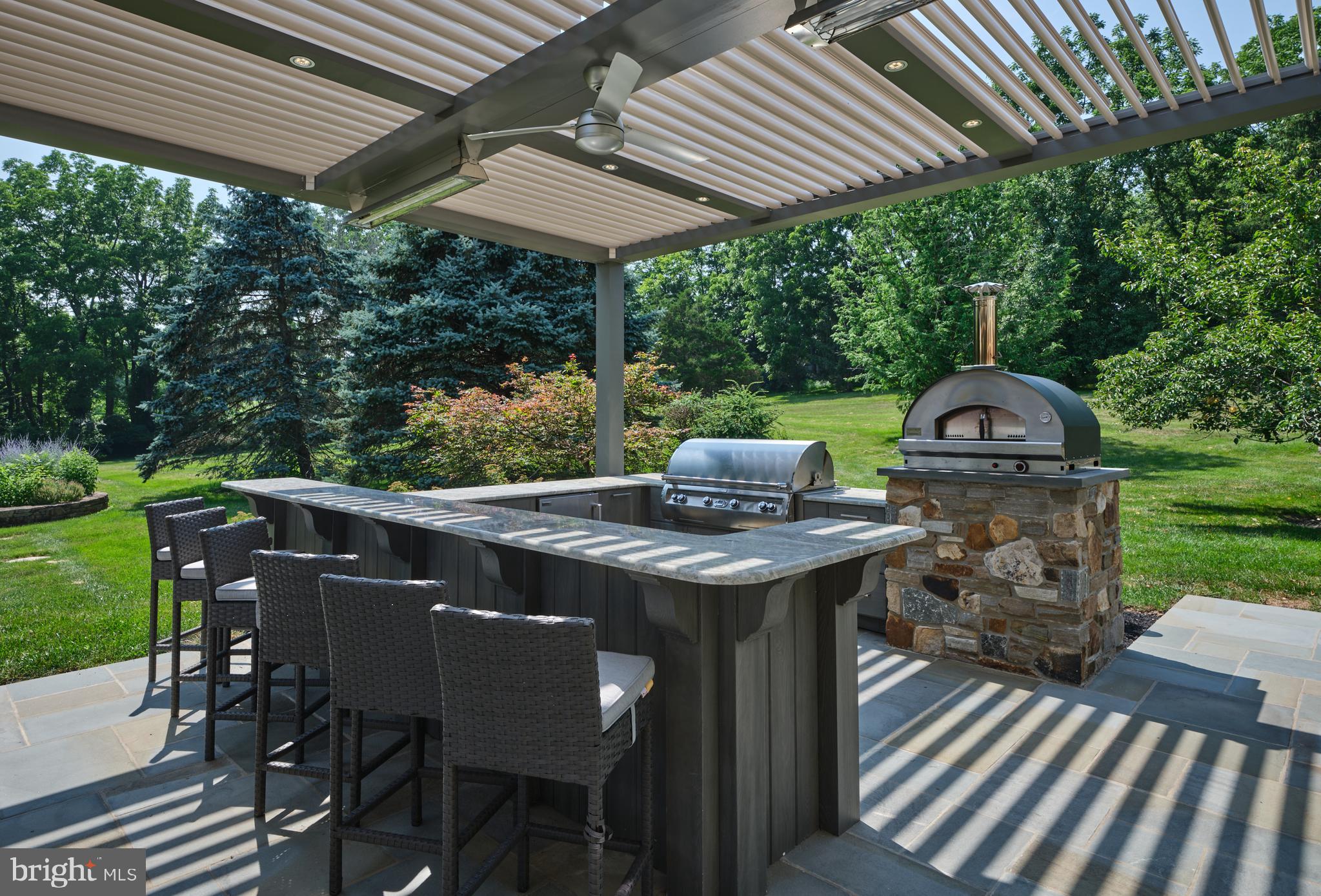 6020 Atkinson Road New Hope, PA 18938 - Photo 76 of 87 a view of a patio with a table chairs and a backyard