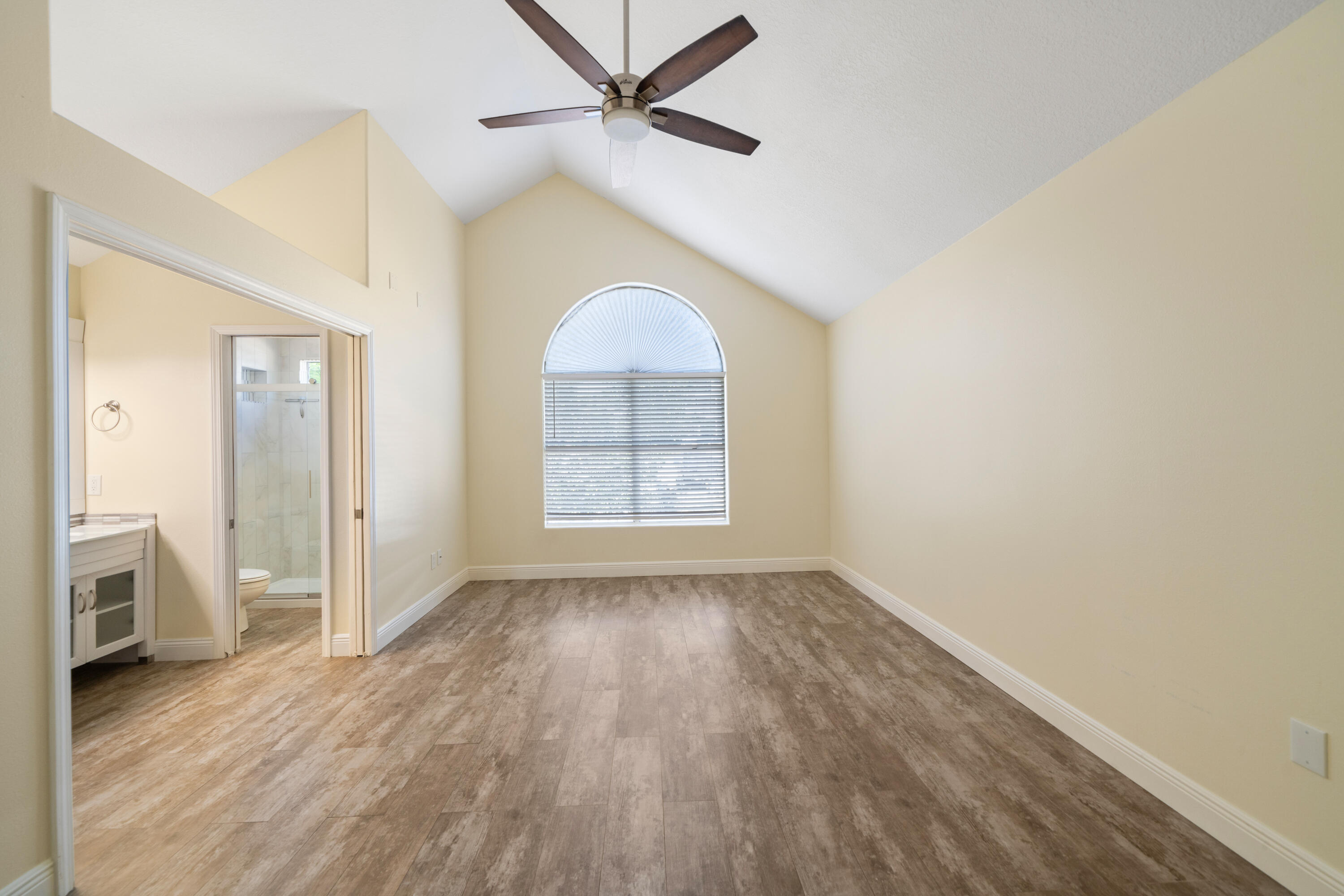 235 Pelican Place, Unit 3 Destin, FL 32541 - Photo 11 of 32 wooden floor in an empty room with a window