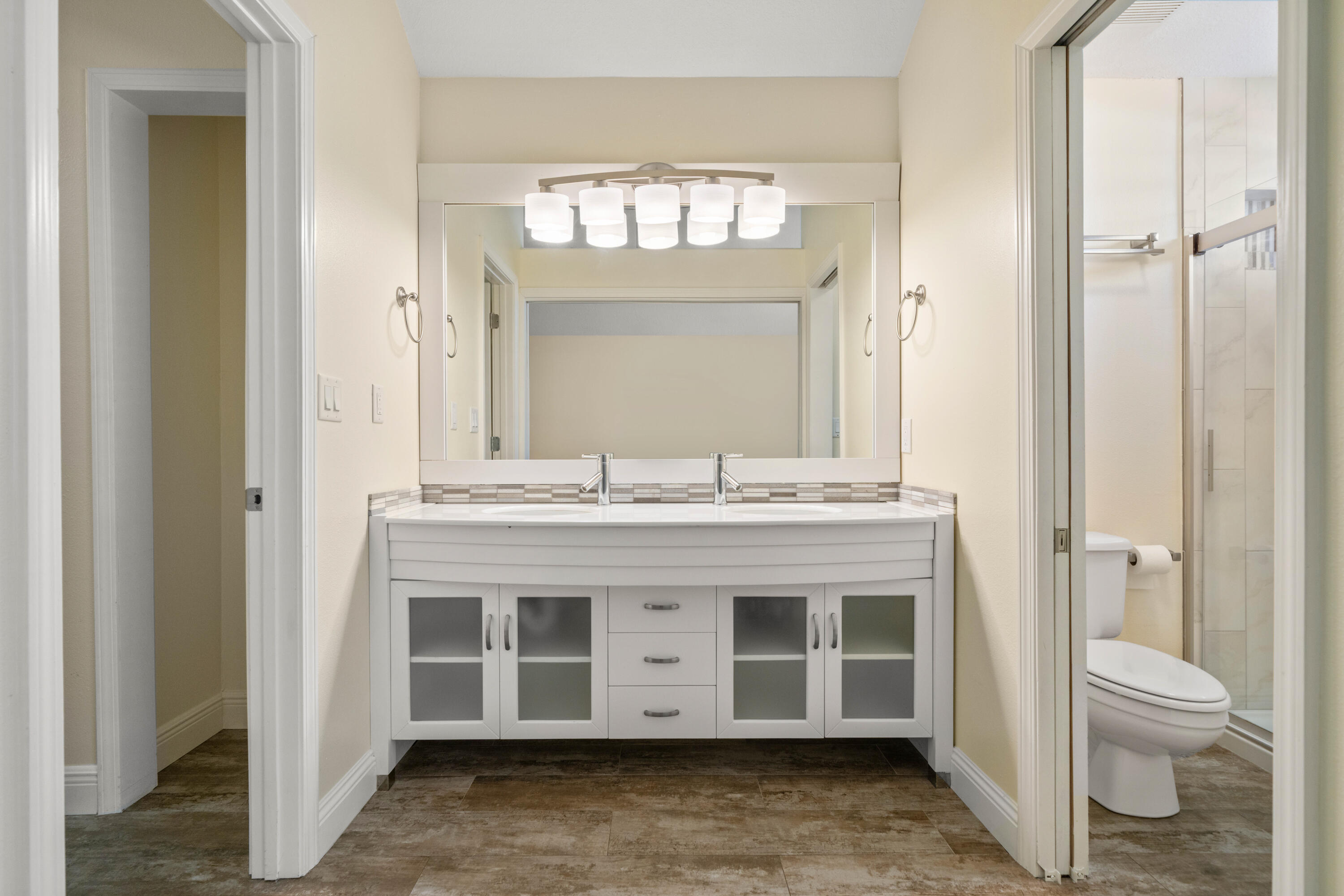 235 Pelican Place, Unit 3 Destin, FL 32541 - Photo 14 of 32 a bathroom with a granite countertop sink a toilet and a shower