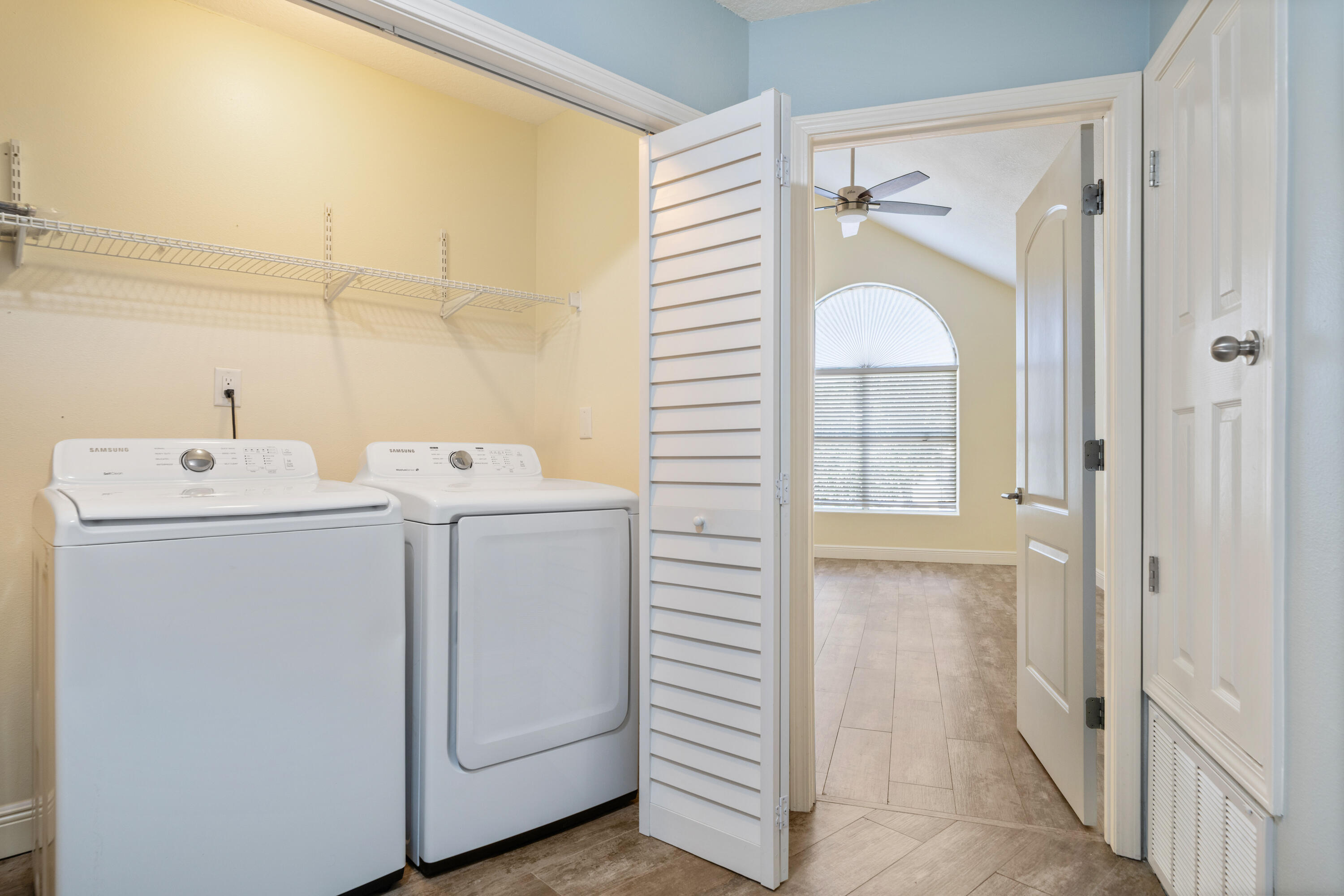 235 Pelican Place, Unit 3 Destin, FL 32541 - Photo 18 of 32 a utility room with dryer and washer