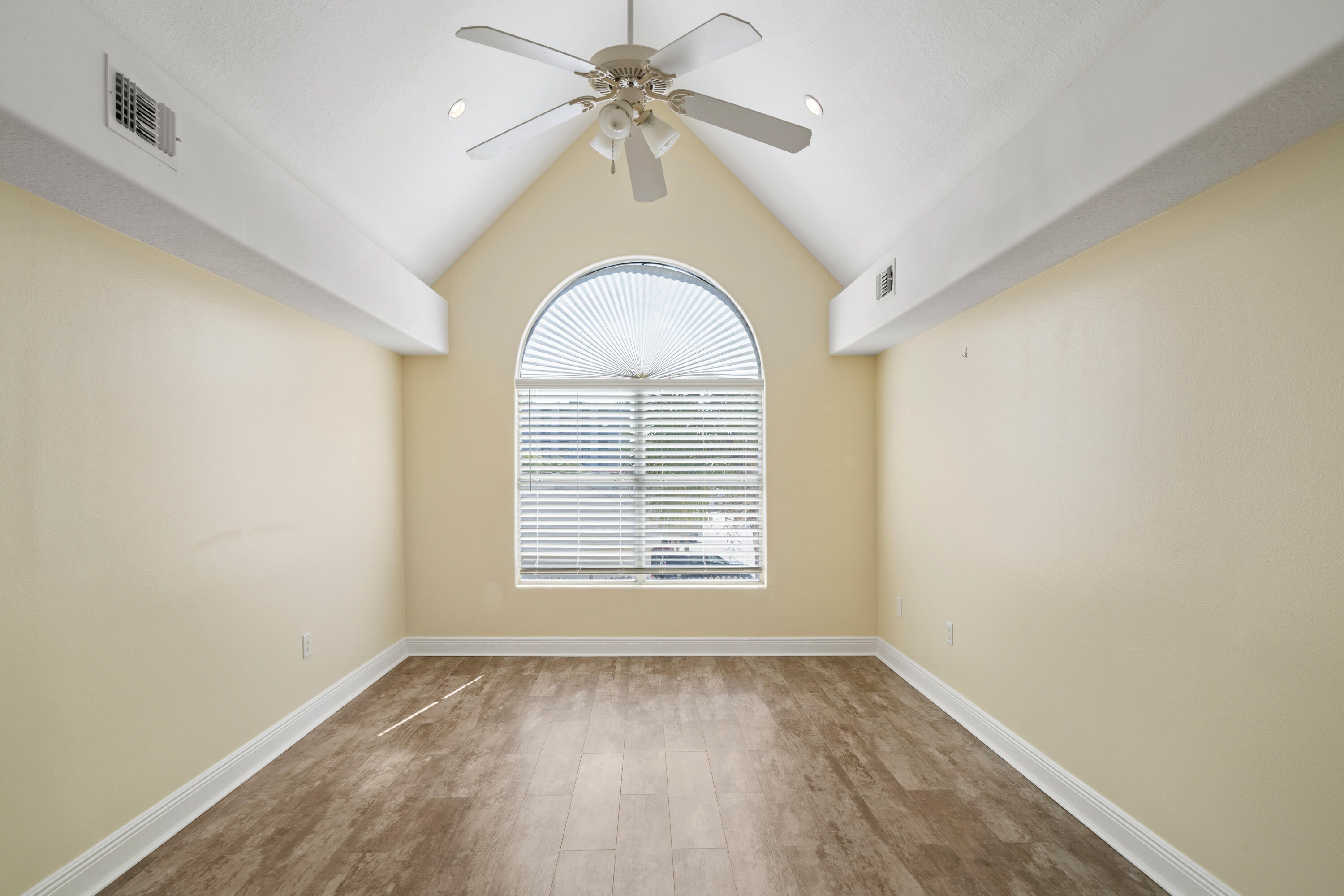 235 Pelican Place, Unit 3 Destin, FL 32541 - Photo 23 of 32 an empty room with a window and a fan