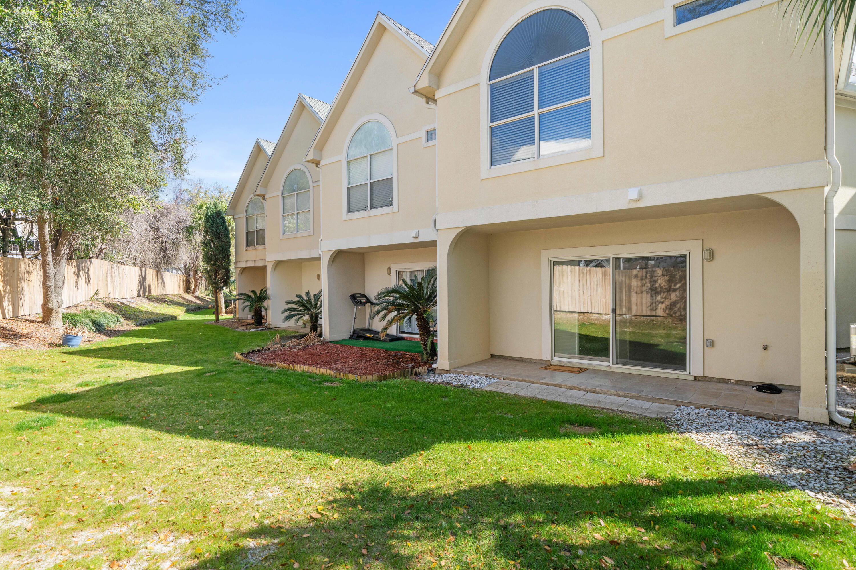 235 Pelican Place, Unit 3 Destin, FL 32541 - Photo 26 of 32 a view of a house with a yard