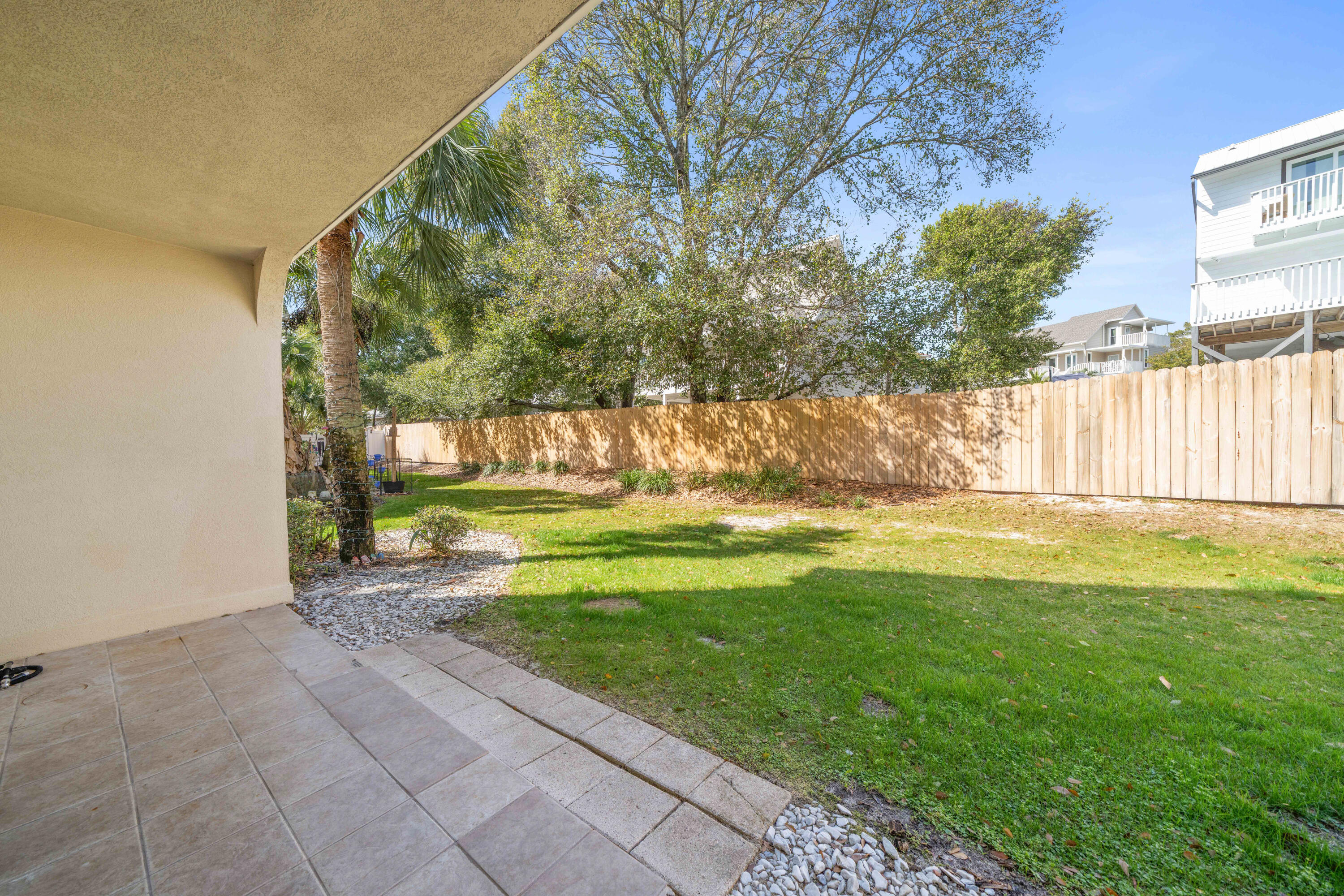 235 Pelican Place, Unit 3 Destin, FL 32541 - Photo 27 of 32 a view of swimming pool from a yard