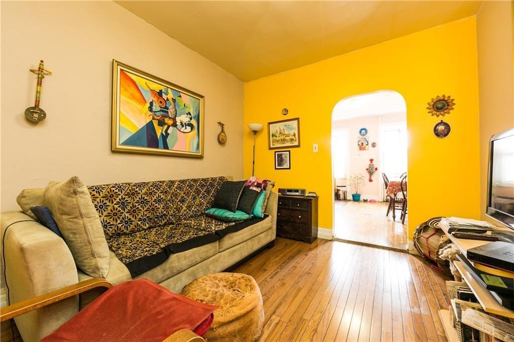 159 9th Street Brooklyn, NY 11215 - Photo 11 of 20 a living room with furniture and a wooden floor