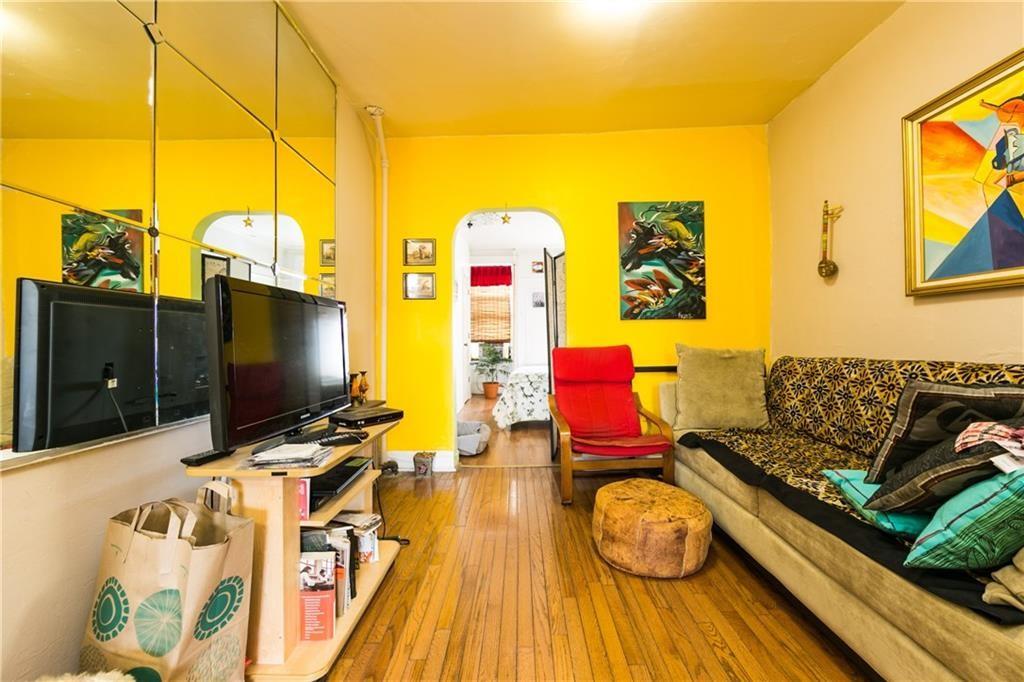 159 9th Street Brooklyn, NY 11215 - Photo 12 of 20 a living room with furniture and a flat screen tv