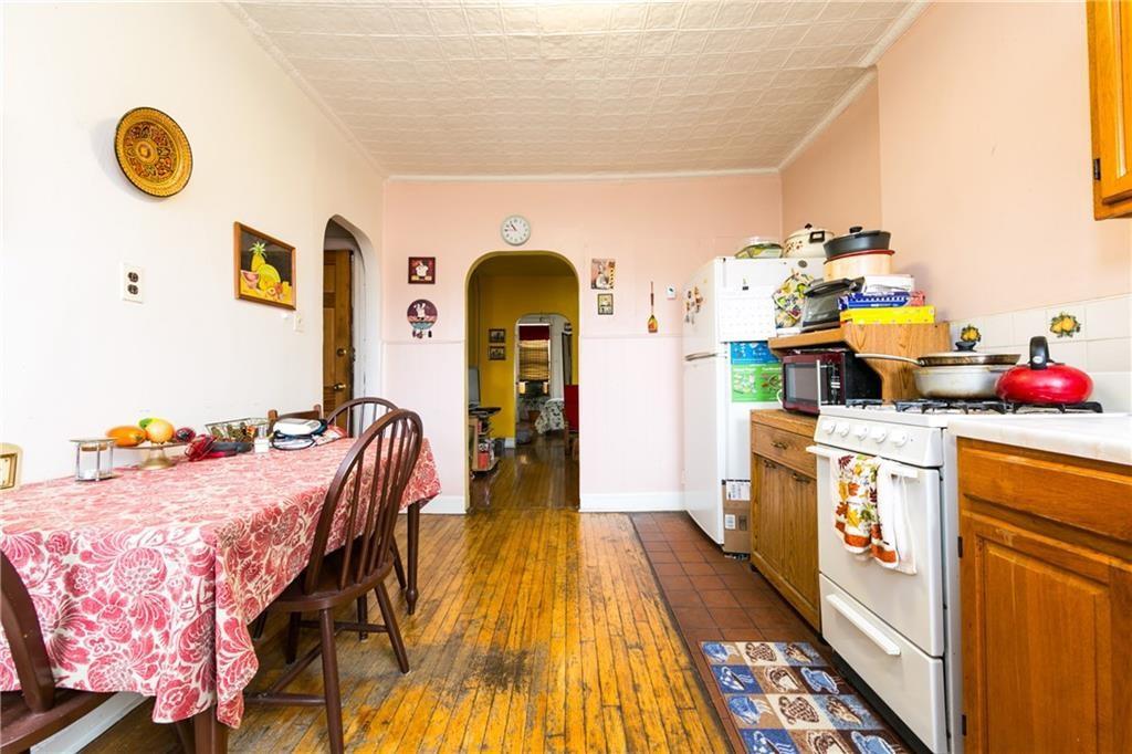 159 9th Street Brooklyn, NY 11215 - Photo 13 of 20 a bed room with a bed and a dresser