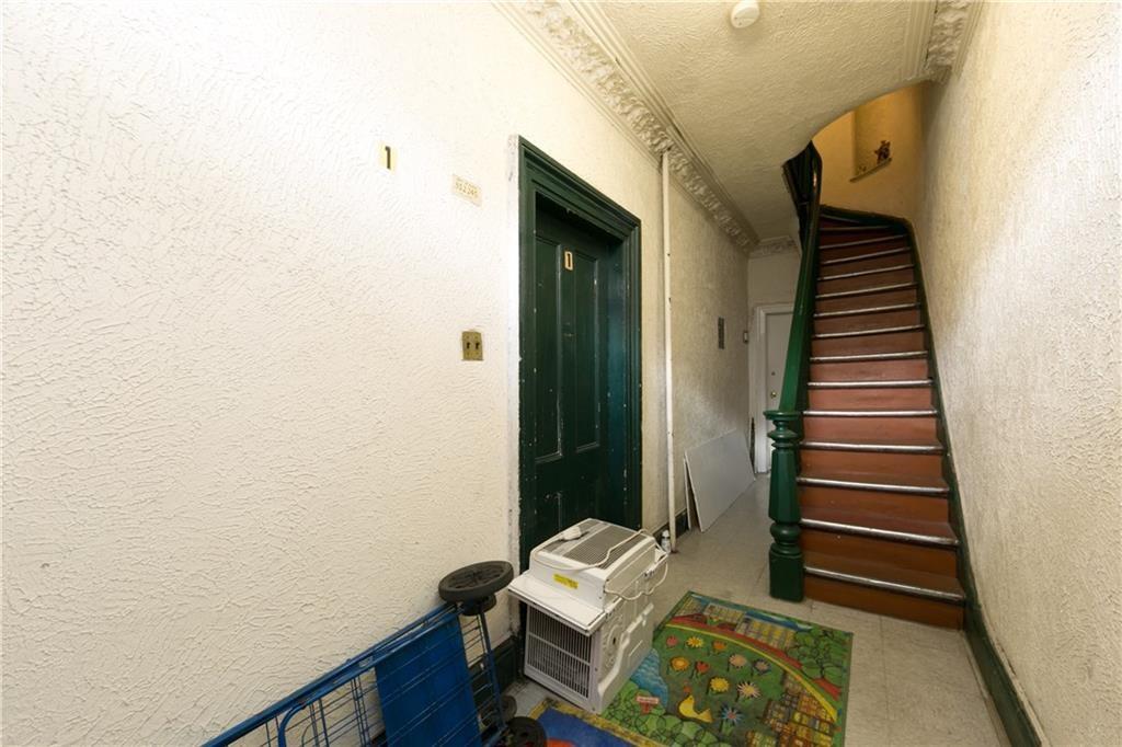 159 9th Street Brooklyn, NY 11215 - Photo 16 of 20 a view of entryway with stairs and wooden floor