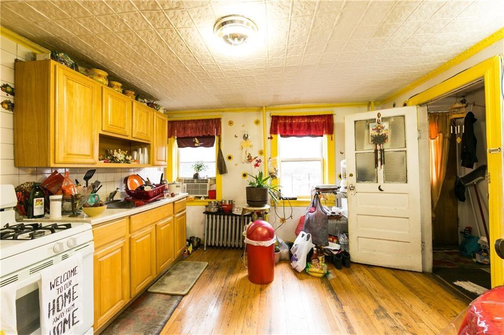 159 9th Street Brooklyn, NY 11215 - Photo 4 of 20 a kitchen with a sink appliances and cabinets