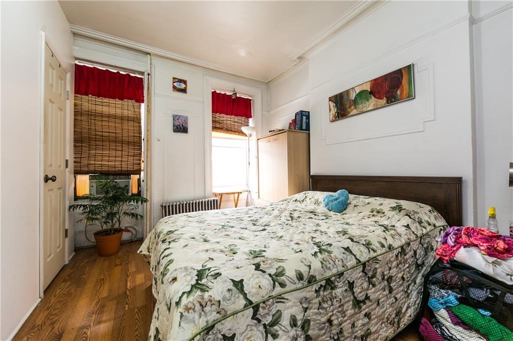 159 9th Street Brooklyn, NY 11215 - Photo 7 of 20 a bedroom with a bed dresser and a window