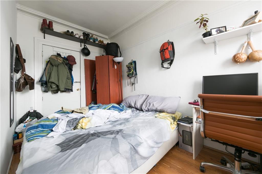 159 9th Street Brooklyn, NY 11215 - Photo 9 of 20 a bedroom with a bed and a walk in closet