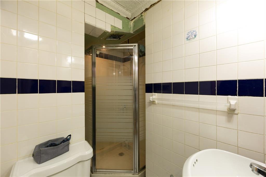 159 9th Street Brooklyn, NY 11215 - Photo 10 of 20 a bathroom with a toilet and a shower