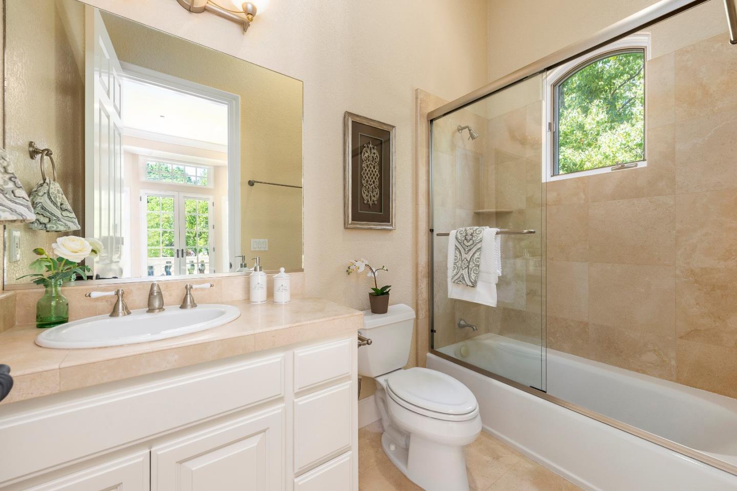 17682 Blanchard Drive Monte Sereno, CA 95030 - Photo 13 of 35 a bathroom with a sink a toilet and shower