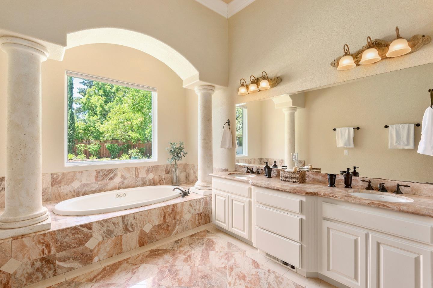 17682 Blanchard Drive Monte Sereno, CA 95030 - Photo 16 of 35 a spacious bathroom with sink a mirror a bathtub and window