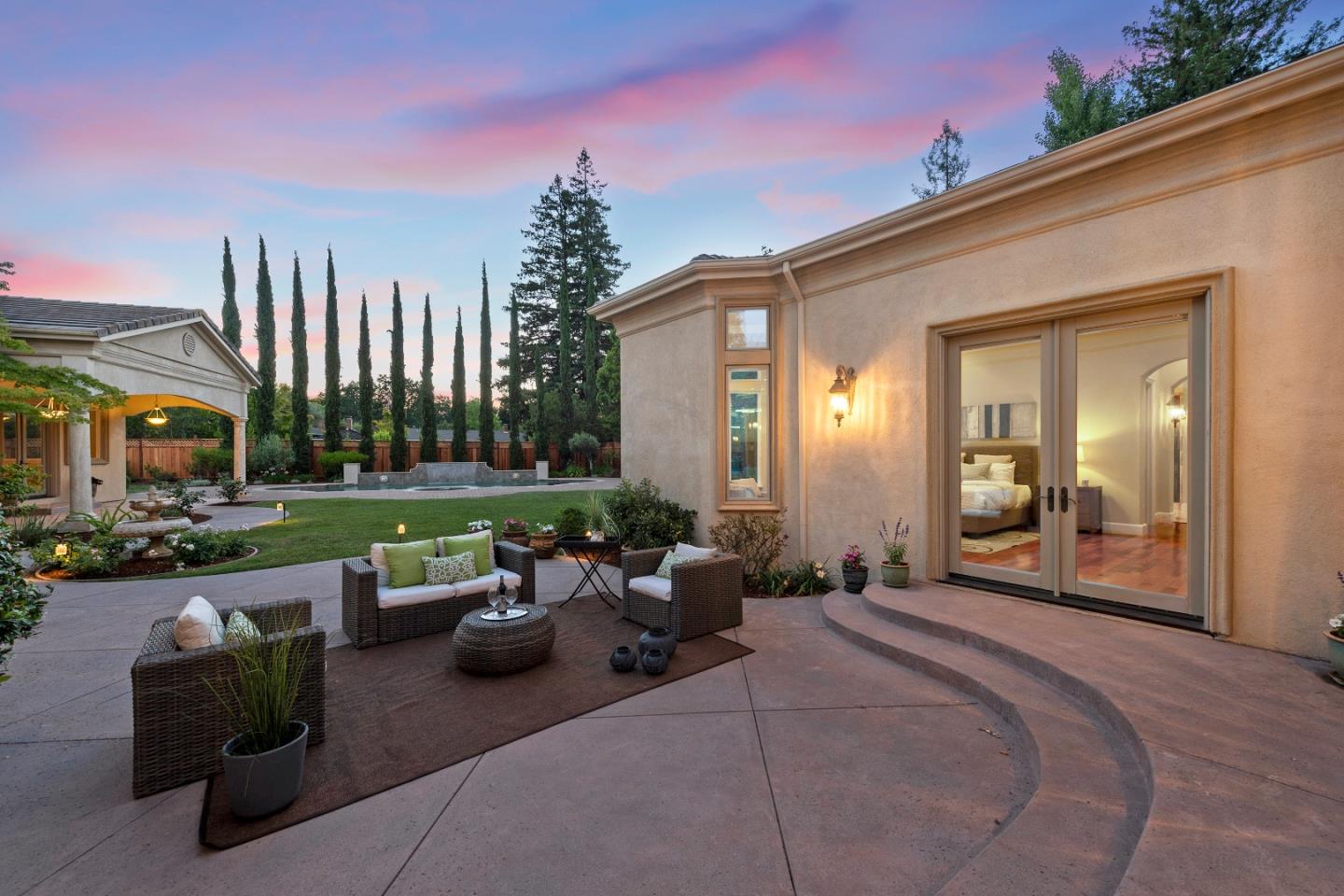 17682 Blanchard Drive Monte Sereno, CA 95030 - Photo 32 of 35 a view of a patio with couches table and chairs and potted plants