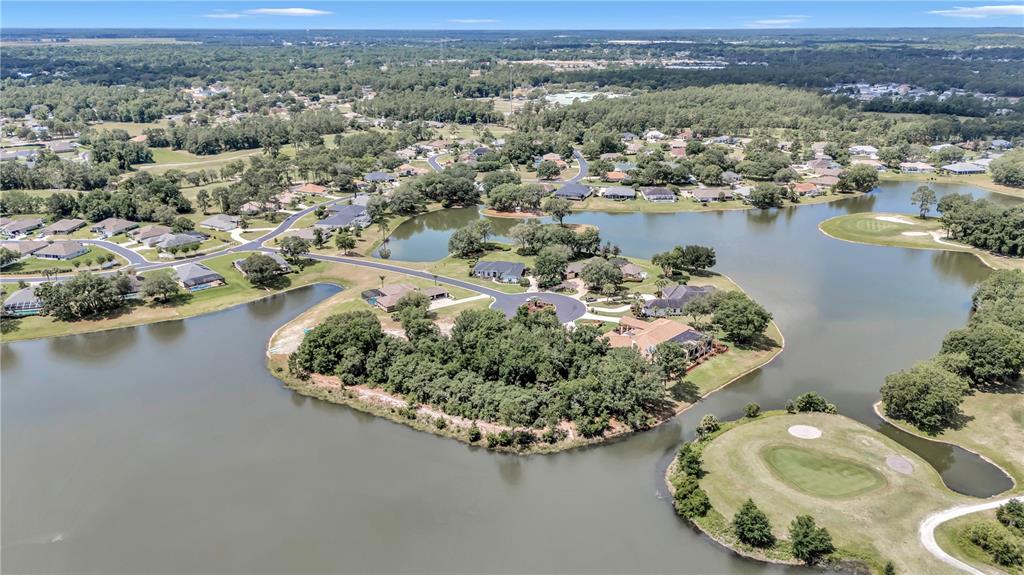 Diamond Island Avenue Ocala, FL 34472 - Photo 2 of 13 an aerial view of a house with a lake view