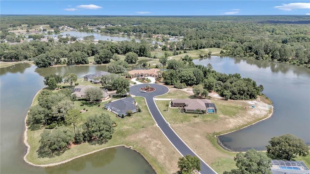 Diamond Island Avenue Ocala, FL 34472 - Photo 6 of 13 an aerial view of a house with a lake view