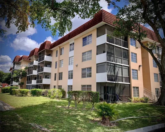 a front view of building with yard