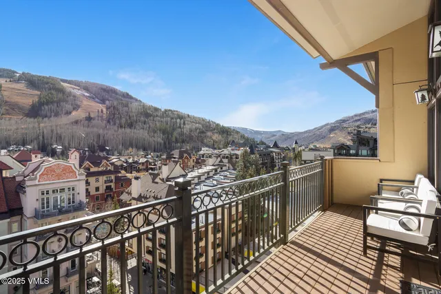 a view of a balcony with furniture