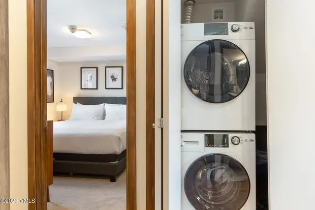 a bedroom with a bed and a view of bathroom