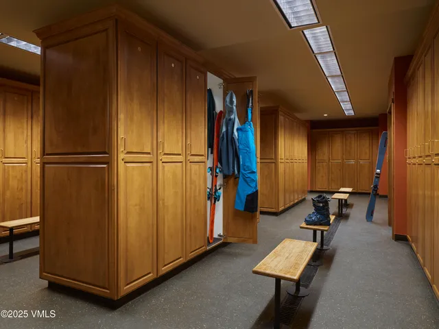 a room with furniture and a refrigerator