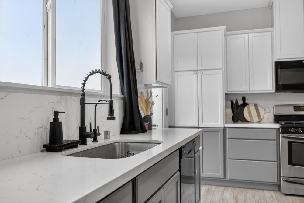 1958 Freedom Way Rio Vista, CA 94571 - Photo 11 of 44 a kitchen with a sink and cabinets