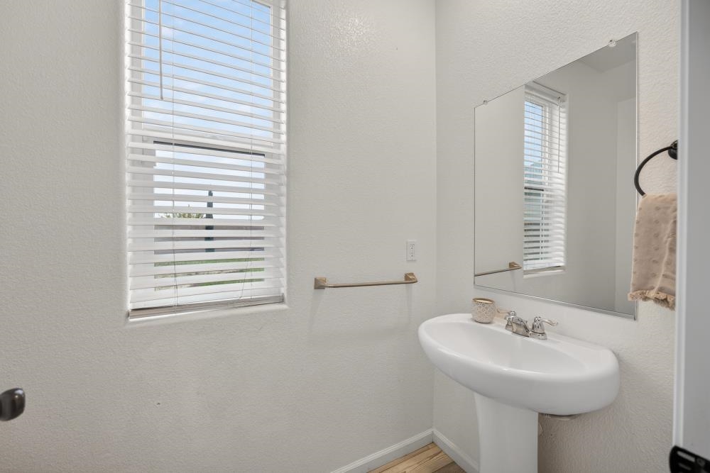 1958 Freedom Way Rio Vista, CA 94571 - Photo 15 of 44 a bathroom with a sink a mirror and a window