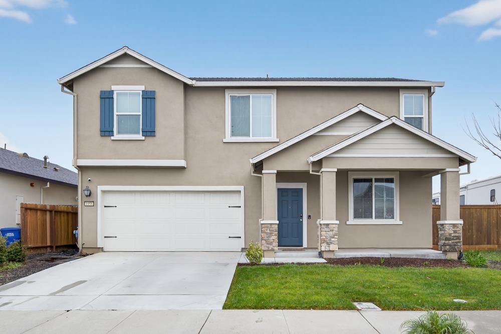 1958 Freedom Way Rio Vista, CA 94571 - Photo 2 of 44 a front view of a house with a yard and garage