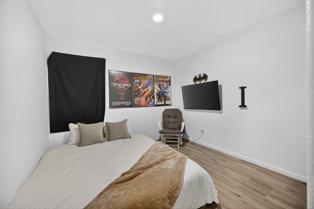 1958 Freedom Way Rio Vista, CA 94571 - Photo 22 of 44 a bedroom with a bed and a flat screen tv
