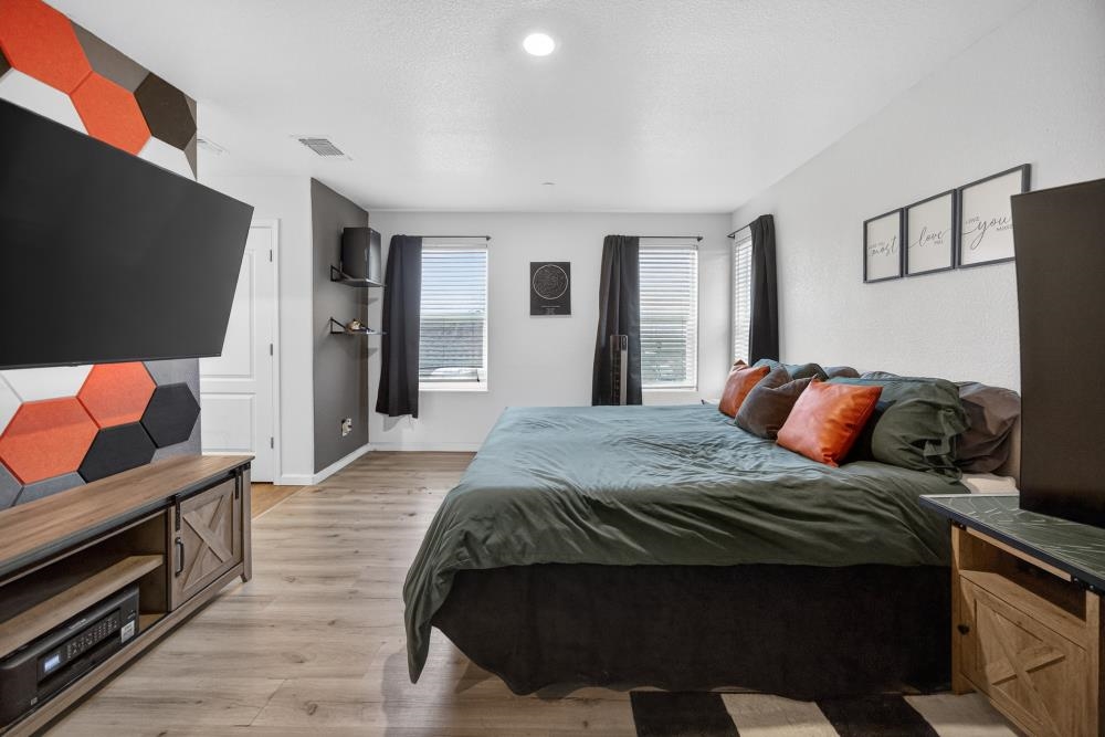 1958 Freedom Way Rio Vista, CA 94571 - Photo 25 of 44 a bedroom with a bed and wooden floor