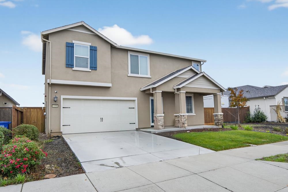 1958 Freedom Way Rio Vista, CA 94571 - Photo 3 of 44 a front view of a house with a yard and garage