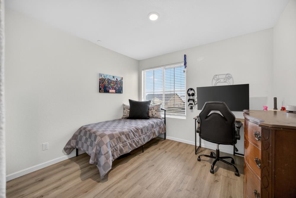 1958 Freedom Way Rio Vista, CA 94571 - Photo 32 of 44 a bedroom with a bed and a chair