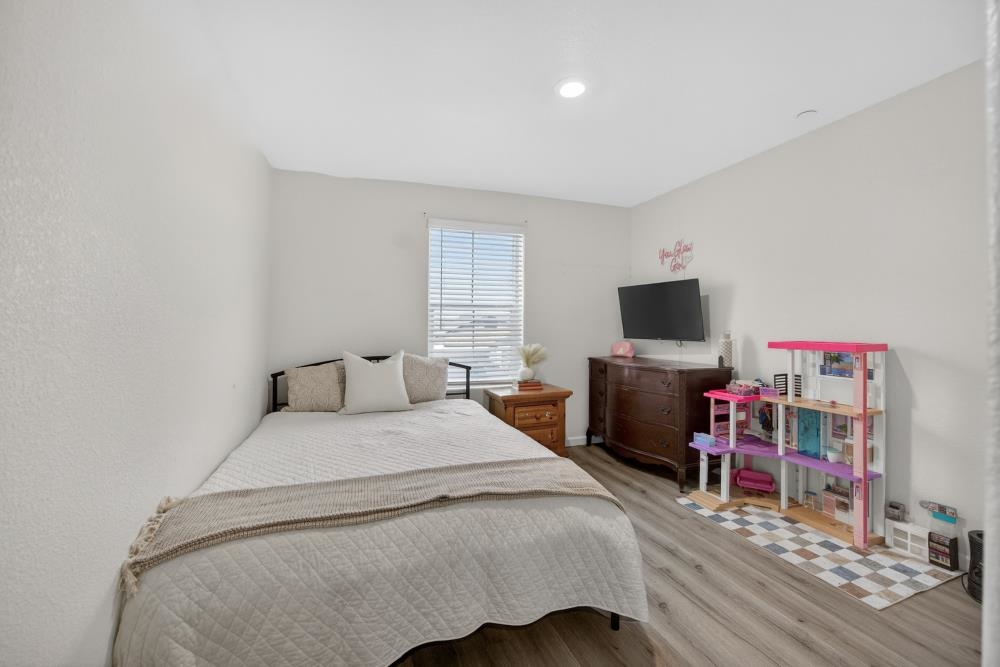 1958 Freedom Way Rio Vista, CA 94571 - Photo 34 of 44 a bedroom with a bed and a flat screen tv