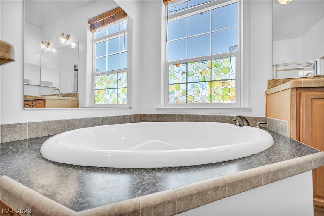 225 California Street Searchlight, NV 89046 - Photo 41 of 64 Relax in the generously sized built-in soaking tub, framed by brightly illuminated windows.