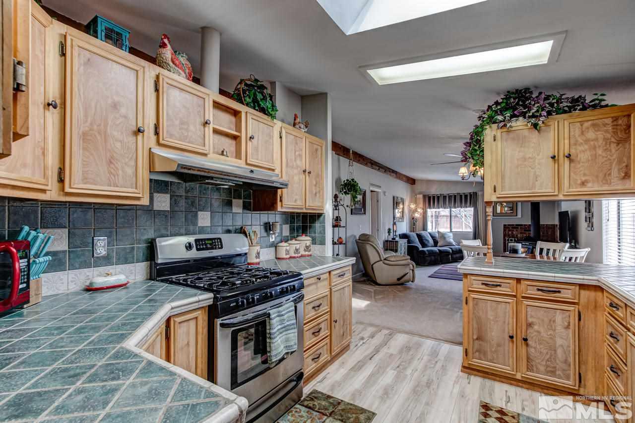 2170 Soda Lake Road Fallon, NV 89406 - Photo 12 of 25 a kitchen with stainless steel appliances granite countertop a stove and a sink