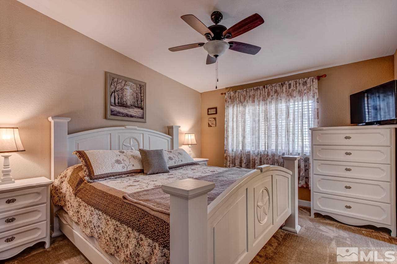 2170 Soda Lake Road Fallon, NV 89406 - Photo 13 of 25 a bedroom with a bed and a flat screen tv