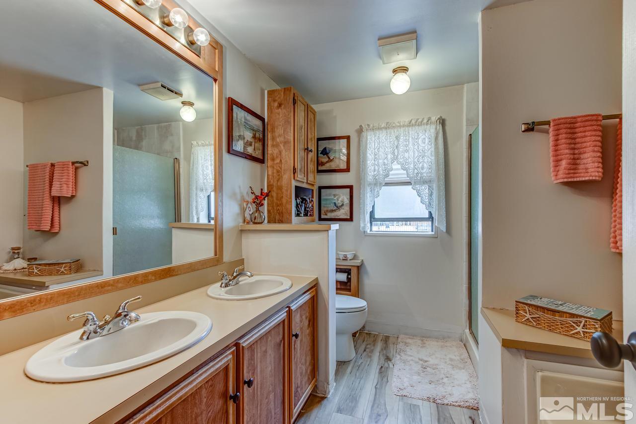 2170 Soda Lake Road Fallon, NV 89406 - Photo 14 of 25 a bathroom with a sink and a mirror