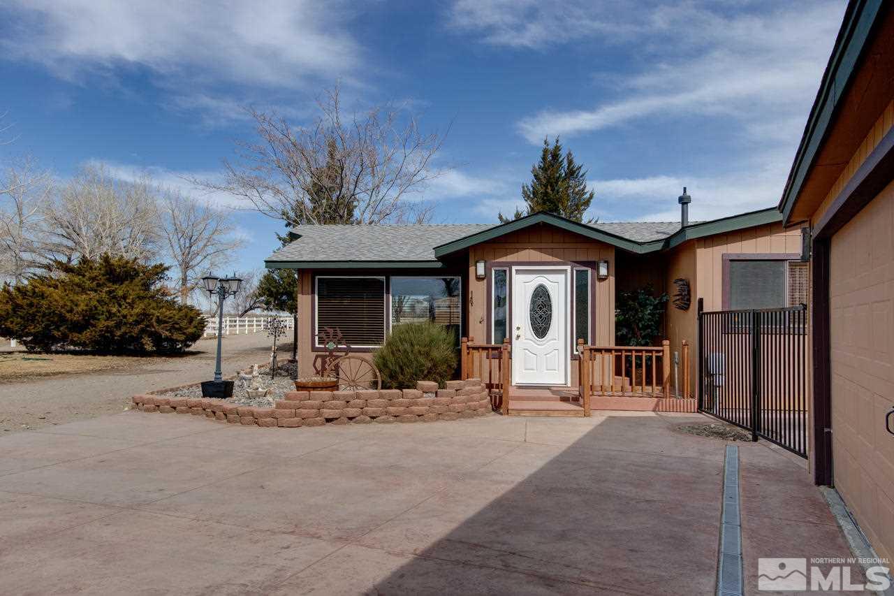 2170 Soda Lake Road Fallon, NV 89406 - Photo 2 of 25 a front view of a house with a garden