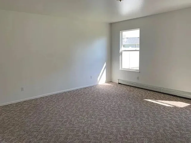 a view of a backyard with swimming pool