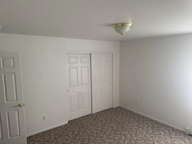 a view of a brick house with a potted plant